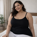 Plus size model sitting comfortably wearing black stretch camisole, breathable cotton lycra fabric
